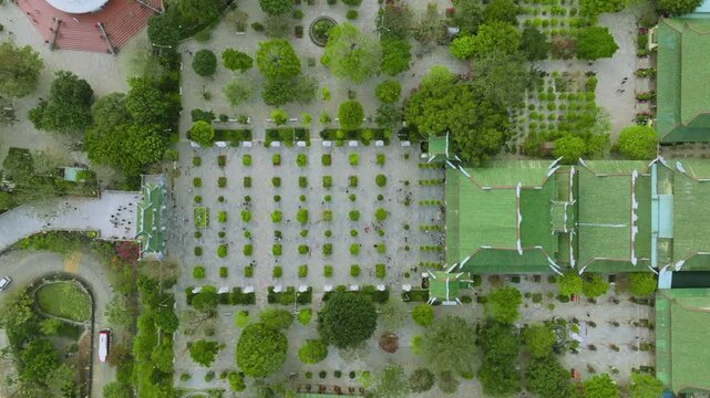 Top-Down Bird's Eye View of Traditional Green Pagoda Roofs in Vietnam
the green-tiled roofs of Linh Ung Pagoda and Thap Xa Loi. This shot highlights the geometric symmetry