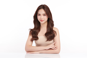Obraz premium A beautiful young Asian woman with clean, fresh skin against a white background. Skincare, facial treatment, cosmetology, beauty, and spa. An elegant portrait of an Asian woman.