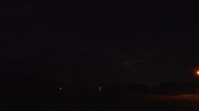 Powerful and loud lightning strike in charged dark night sky, bad omen concept