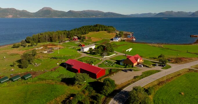 Kvitnes Gaard coastal farm venue sits by fjord in Norway Aerial