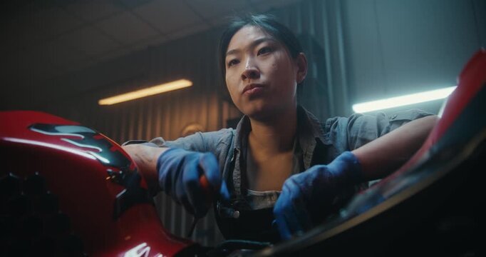 Female Mechanic Beside Partially Disassembled Motorcycle, Tired and Discouraged While Examining Exposed Electronic Components. Attempt Restart Bike Electrical System Failed. Technical Difficulties.