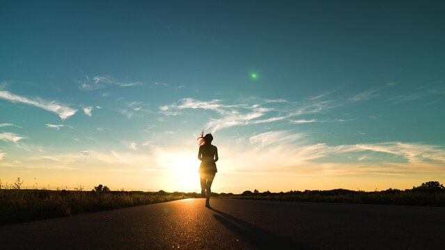 silhouette sports girl running legs along road sunset, enjoying life, runner man, american woman running along road, runner jogging trail, exercise, outdoor sports training, sprint marathon endurance