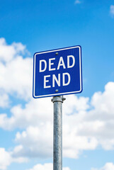 Dead End Road Sign Against Blue Sky with Clouds