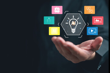 Fototapeta premium Businessman hand hold artificial intelligence interface with light bulb AI icon and colorful application symbol show machine learning, automation, digital innovation and smart technology solution.