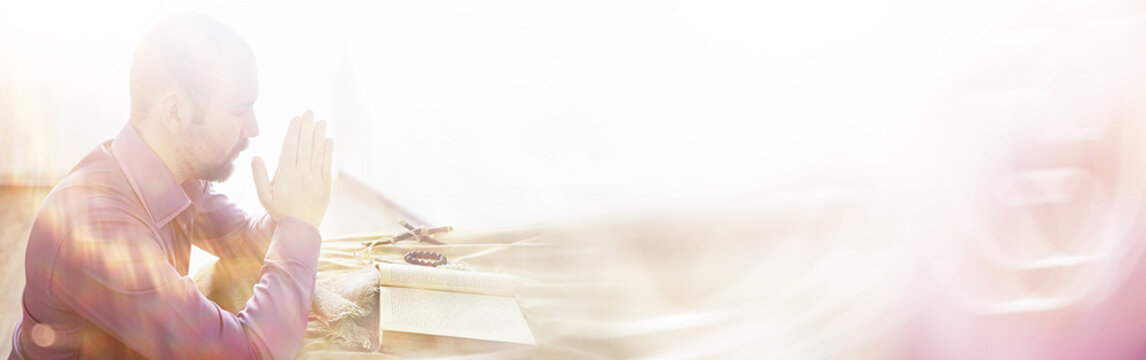 The man prays in the bible. Christians and Bible study concept. Studying the Word Of God in church.