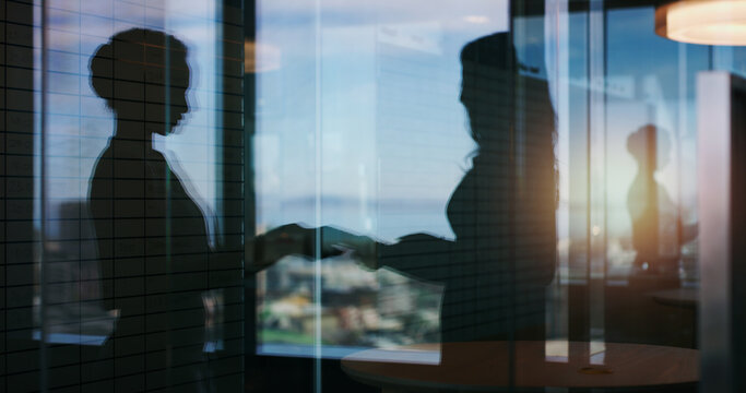 Glass, office and business people in meeting, teamwork or planning for case and together in law firm. Silhouette, colleagues and collaboration for trial, lawyers and discussion for legal assignment