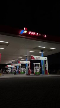 Gas Station at Night with Fuel Pumps and Bright Lights &ndash; Urban Petrol Station Exterior