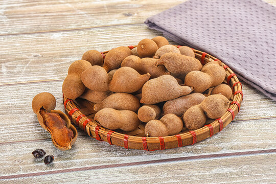Tropical exotic Tamarind fruit heap