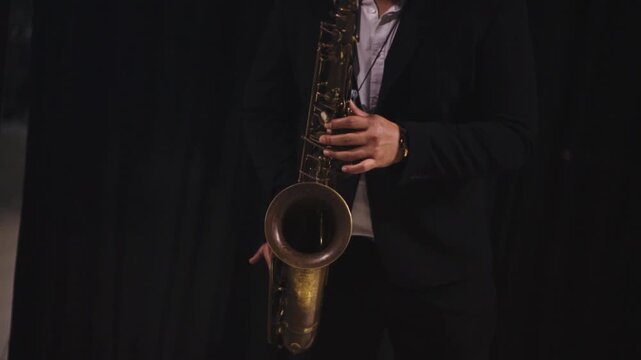 Cinematic Close-Up Professional Musician Playing Saxophone with minimalist black background - Jazz Performance Concept 