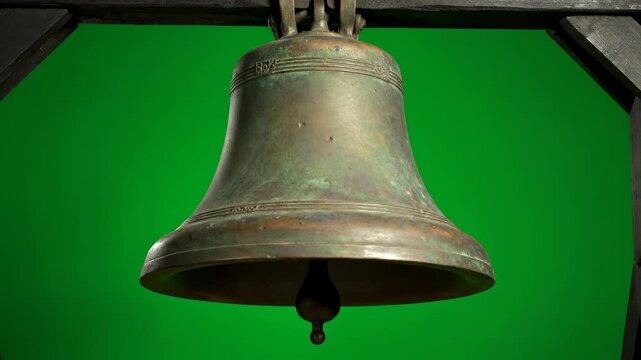An old church bell ringing with a deep, resonating sound, isolated on solid green background historical, town, object