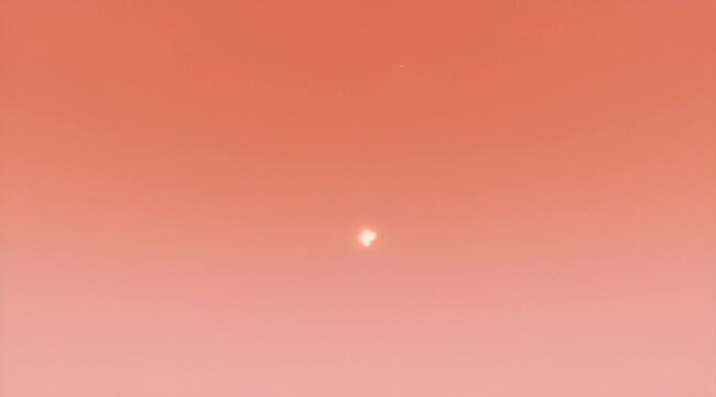 Monochromatic Orange Background with a Central Focal Point of Light