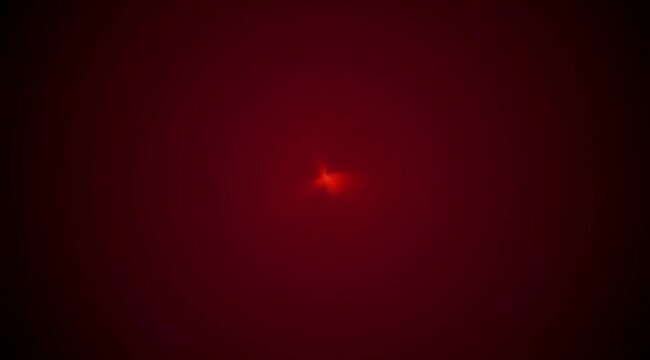 Deep crimson abstract with central radiant glow evoking cosmic singularity and mystery