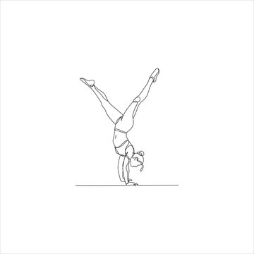 A woman doing a handstand on a gym floor