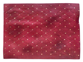 Fototapeta premium Wallpaper background of red quilted leather texture with golden pattern and decorative studs top view