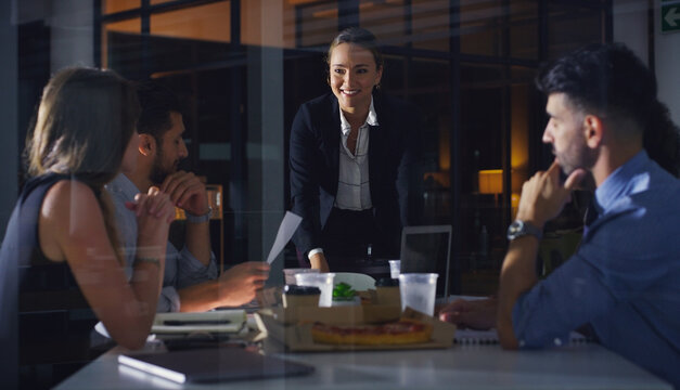 Meeting, night and team with business people in office for discussion, pizza or broker review. Planning, fast food and collaboration with employees in agency for overtime, trader workshop and project