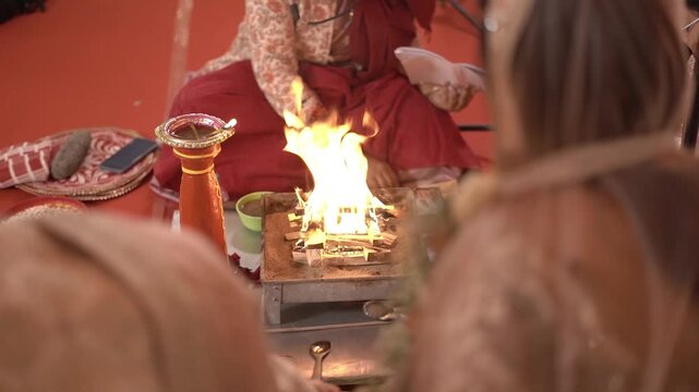 Hindu Wedding Ceremony: Couple Offering Oblations into the Sacred Yagna Fire