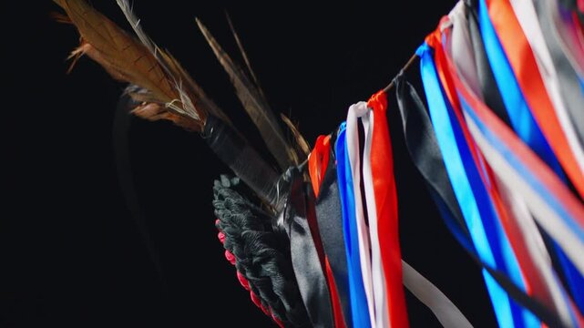 Close up of Kurent carnival mask with feathers and colorful ribbons during Pust festival Slovenia