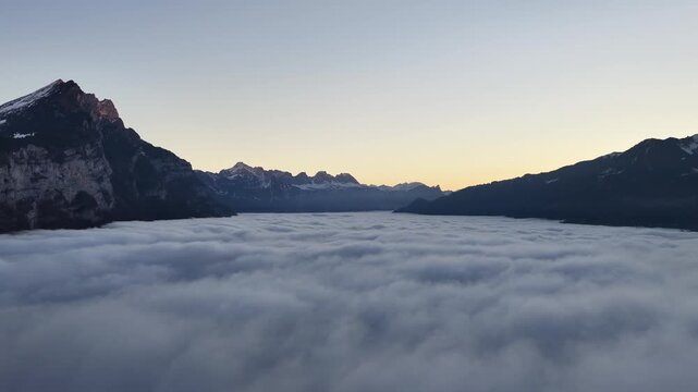 Aerial view of Walensee lake surrounded by Swiss mountains at sunrise