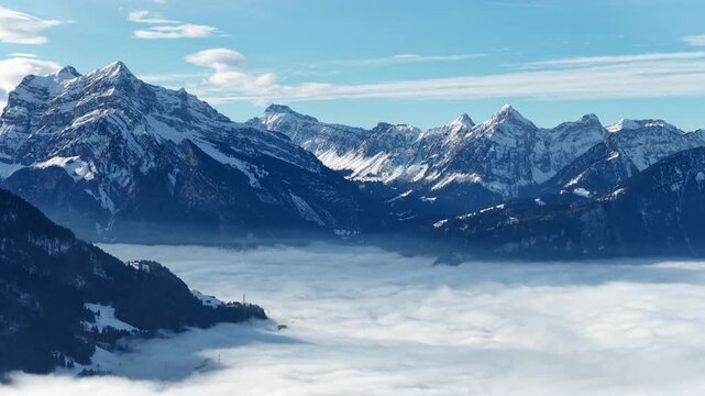 Snowy Alps over Walensee, serene and majestic Swiss landscape