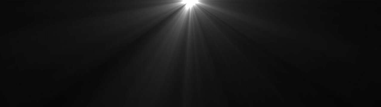 Abstract shimmering white light rays burst and rotate slowly, creating dynamic optical flare effect on a completely dark background. Sun rays effect footage overlay.