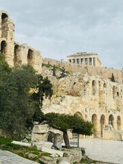 Fototapeta premium Low-angle view of the Acropolis of Athens with ancient ruins towering above against a clear blue sky