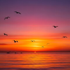 Fototapeta premium Sunset over calm ocean with birds.
