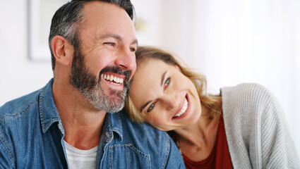 Fototapeta premium Happy, laugh and couple on sofa on weekend for bonding, relationship and conversation in home. Marriage, house and man with woman on couch for funny joke, connection and relax together in living room