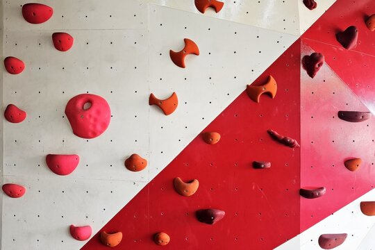Indoor climbing bouldering wall background.
