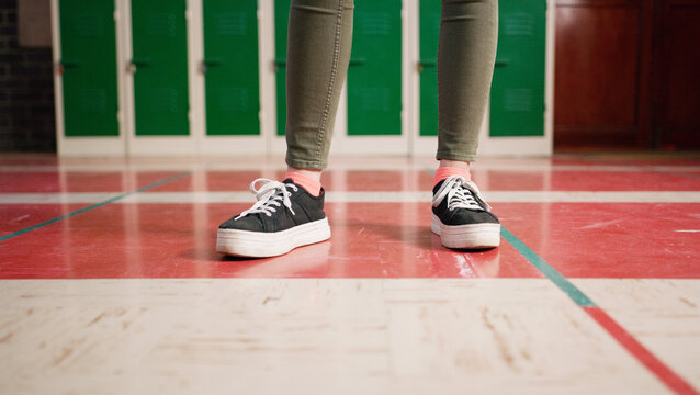 Legs, student or teenager in high school for education, casual dress code policy or sneakers for learning. Comfortable footwear, pupil or kid with compliance for academy rules, space or study outfit