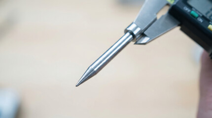 Naklejka premium Metallic Gear Tip Probe in Handheld Caliper Tool