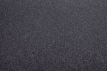 Fototapeta premium Black paper texture background with rough fiber surface and dark grey cardboard pattern