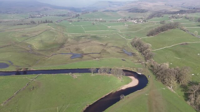 Aerial view over the River Ure in Hawes from a drone 4K video