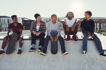 Relax, group and friends with skateboard outdoor for bonding, sports break or chat on ramp. Skate park, talking and men together for holiday, resting or hangout for conversation with sunshine © peopleimages.com