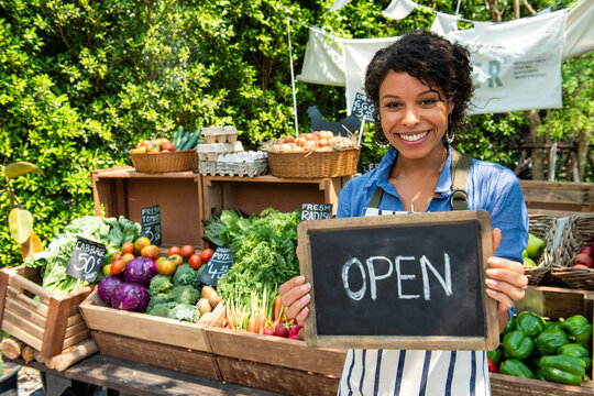Smiling vendor at farmers market