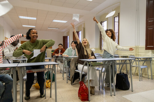 Happy diverse students celebrating end of school year