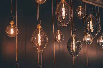 Fototapeta premium Background light bulb blurry background interior design bar table chair windows with copy space. Blurred background cafe coffee shop restaurant in shopping mall with light bokeh business event