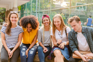 Diverse group enjoying outdoor gathering.