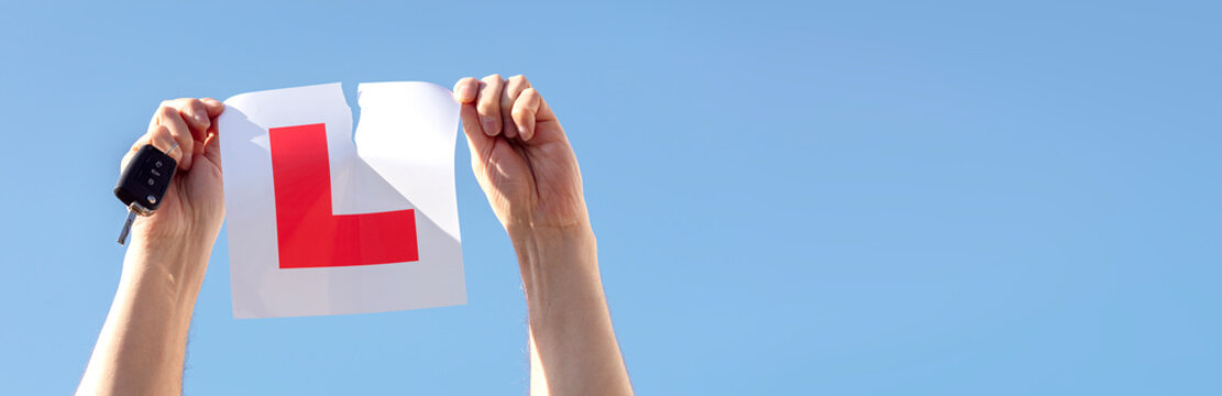 Tearing up L plate after passing driving test background