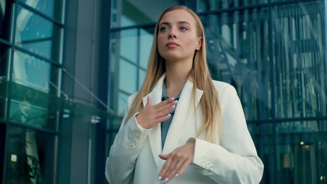 Confident proud Caucasian business woman adjusting formal suit outdoor near corporate office building successful female girl lady businesswoman leader CEO boss director walking away manager employment