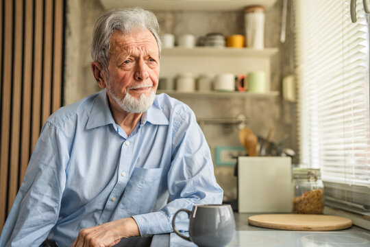 Senior man contemplating life with morning coffee