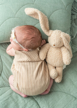 Sleeping Newborn with Teddy Banny