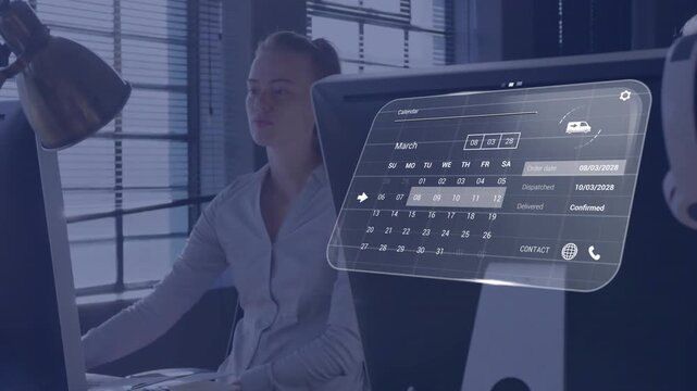 Woman at desk reaching keyboard, navigating AR calendar, updating status labels for business