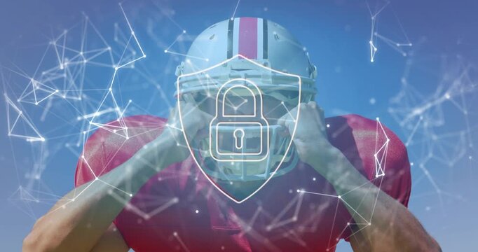 Football player leaning, adjusting helmet readying for play, shield padlock overlay tracking torso