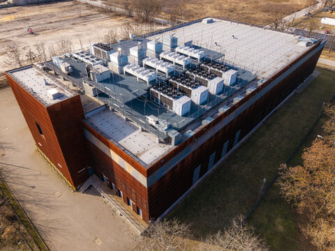 Data center building showcasing extensive rooftop hvac and ventilation systems, representing modern compute infrastructure and cooling, Warsaw, Masovian Voivodeship, Poland.