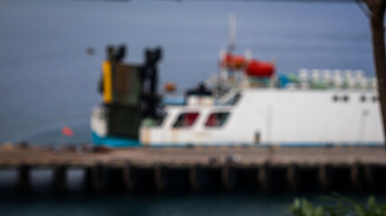 Fototapeta premium Out-of-focus Nautical Scene with Ships and Traditional Wooden Boats