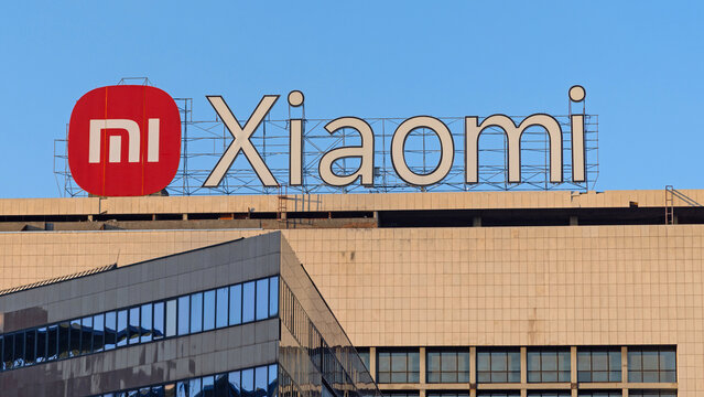 Large Mi Xiaomi Sign at Top Office Building in New Belgrade Serbia Sunny Day