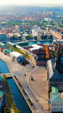 Vertical video. Copenhagen, Denmark. Christiansborg (Danish Christiansborg Slot) is  Danish royal palace since 1740. The building of Danish parliament Folketing. Located in old part of Copenhagen. Dr