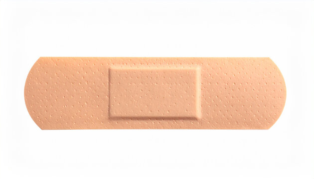 Horizontal flesh toned adhesive bandage with textured surface on white