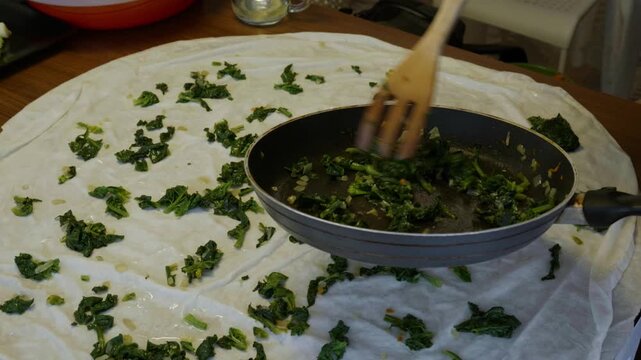 Placing Sauteed Spinach Filling over Phyllo Dough for Homemade Borek