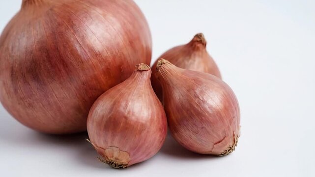 Red onions on white background.